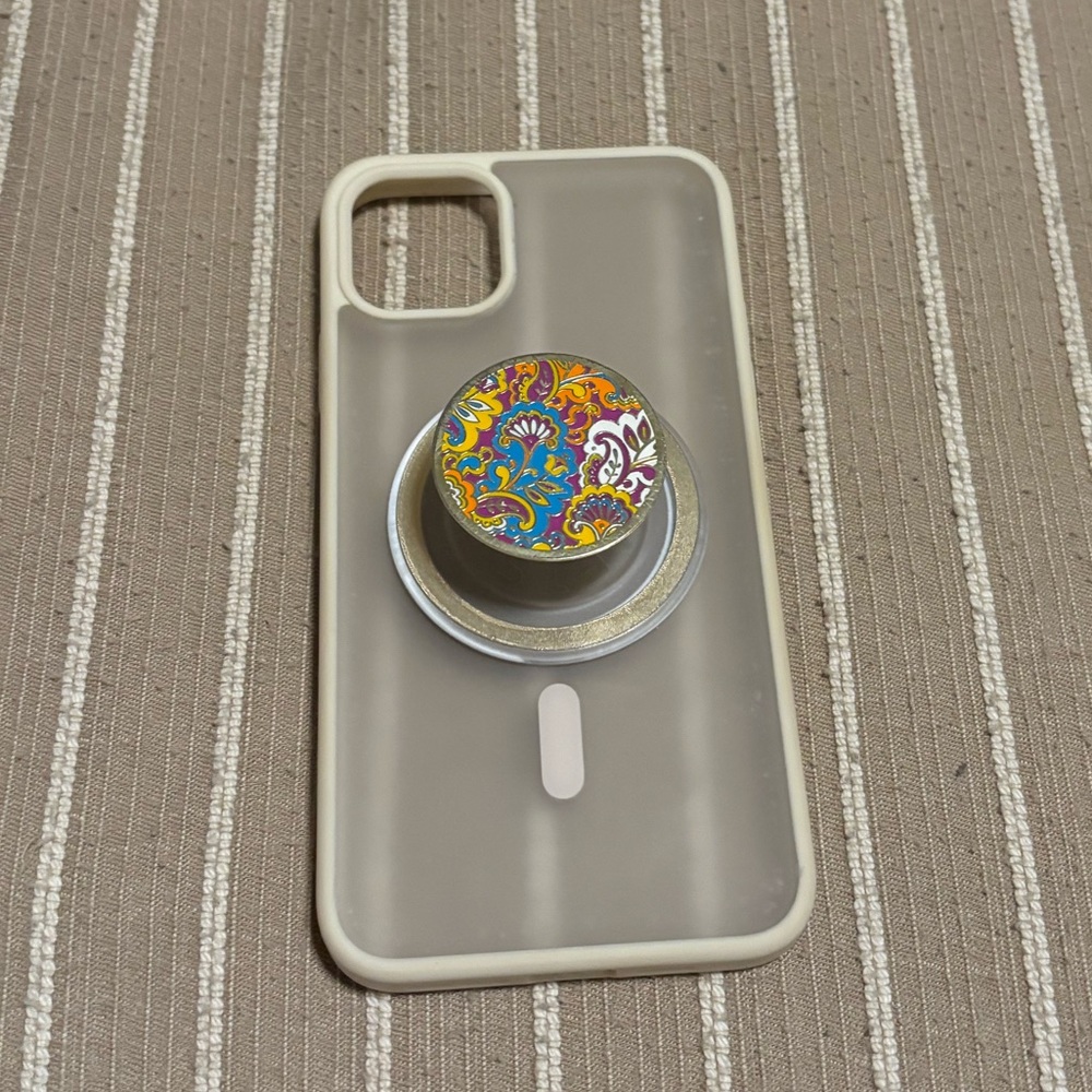 MagSafe case for an iPhone 11 Pro Max with a pop socket attached magnetically.